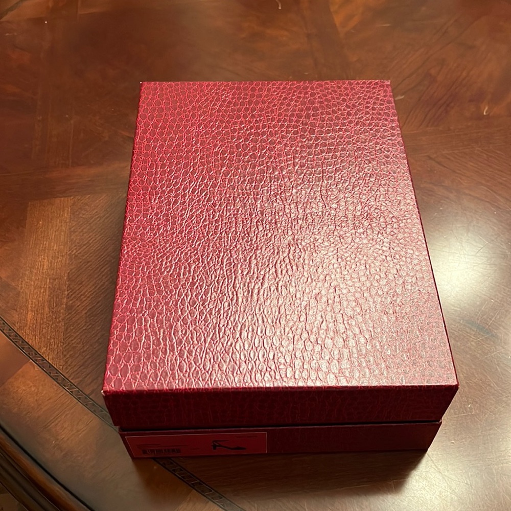 Never worn outside only tried on. New condition. Original box and packing.